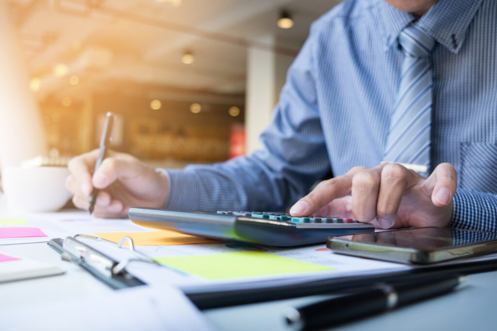 Reviewing business finances with accounts and a calculator